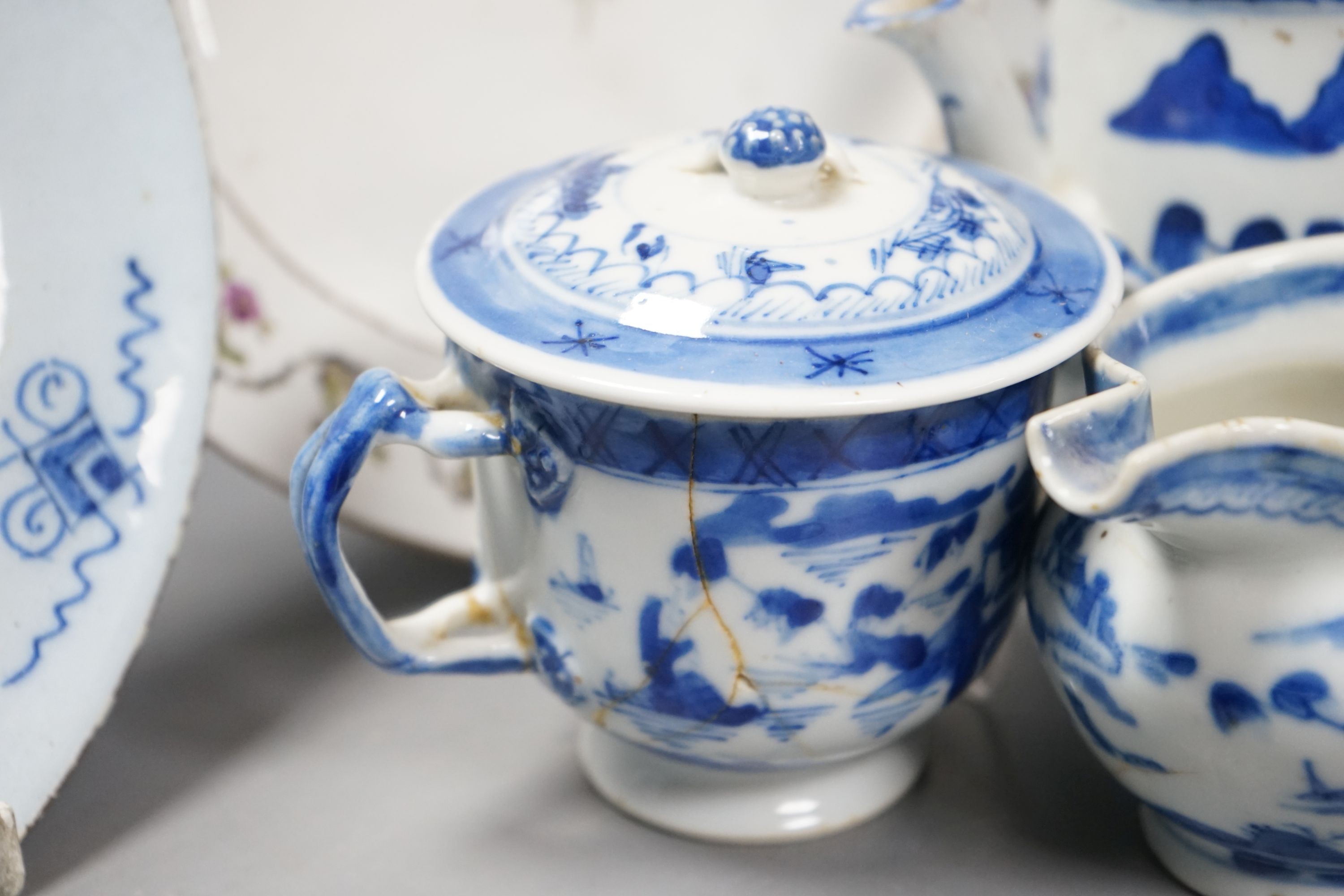 A Chinese blue and white bulb dish and a three piece teaset, a Delft plate and an English porcelain plate, 18th/19th century 23cm